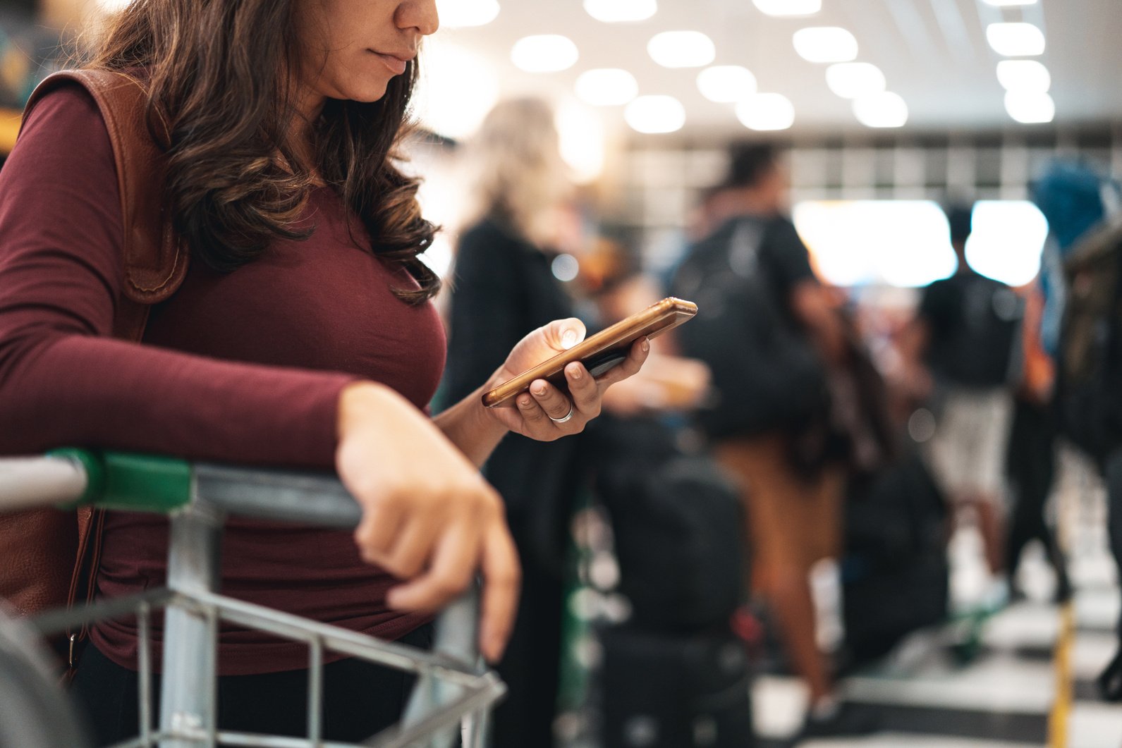 Tourists standing in queue at airport